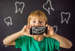 Belleville Dentist Office Boy Holding Quinte Mall Dental Xray